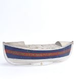 A mid-20th century painted metal boat money collection box, for Contributions for the Royal National