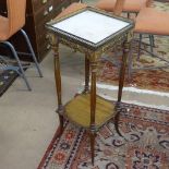 A French walnut jardiniere stand, with pierced brass gallery, marble top, on fluted legs and