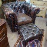A brown leather studded upholstered Chesterfield armchair, and similar matching footstool