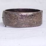 A Liberty & Co floral engraved silver bangle, Birmingham 1984, maker's marks L&Co