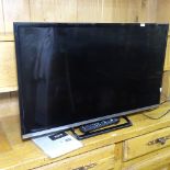 A Panasonic 32" flat screen television with remote, GWO