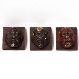 3 Oriental painted and lacquered cork mounted head plaques, with glass eyes and applied hair,