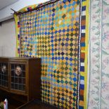 A multi-coloured patchwork throw, 214cm x 140cm