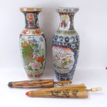 2 parasols and 2 similar baluster vases decorated with birds and flowers, height 60.5cm