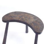 A stained and penned hardwood curved tripod stool, height 36cm