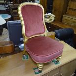 An upholstered and giltwood child's chair, on fluted legs