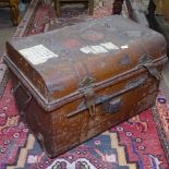 An Antique metal dome-top travel trunk with labels, W52cm, D36cm, H37cm