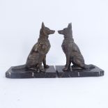 A pair of Art Deco pewter Alsatian dog bookends, on veined black marble plinths, overall height 18cm
