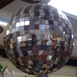 A large Vintage peach and clear mirror section disco ball, diameter approx 45cm (missing some