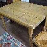 A Victorian plank-top pine kitchen table, end-frieze drawer, raised on baluster turned legs, W105cm,