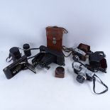 A collection of various Vintage cameras, including folding Ensign, Yashica, and Minolta