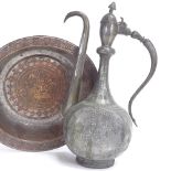 A Middle Eastern Persian tinned copper ewer, and a similar circular bowl, engraved man kneeling with