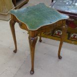 A Queen Anne style lady's walnut writing table, the hinged leather top revealing a fitted interior