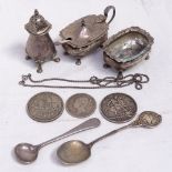 A 3-piece silver cruet set, a silver teaspoon, an 1889 crown, a 1935 crown, and an 1878 half