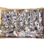 A large collection of plated souvenir spoons