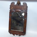 An Oriental style lacquered mahogany-framed rectangular wall mirror, overall height 82cm
