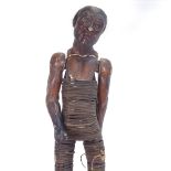 A 19th century carved and lacquered wood figure of an elderly man, bentwood-bound body with