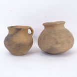 A Chinese Neolithic clay pot with handle, 11.5cm, and an incised Chinese clay vase