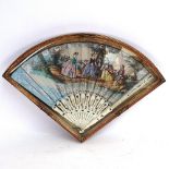 A 19th century Italian ivory fan, over-painted printed scenes, in glazed display case, case length