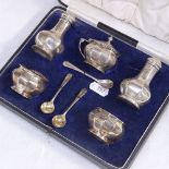 A 1920s 5-piece silver cruet set in fitted case, hallmarks for Birmingham, maker's G.M. Co for
