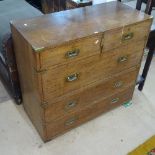 An Antique teak 2-section military chest, with 2 short and 3 long drawers, recessed brass hinges, on