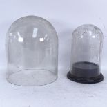 A very large Pyrex dome and a smaller glass dome and matched base, largest height 34cm (2)