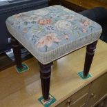 A 19th century mahogany stool of rectangular form, with needlework upholstered seat, raised on