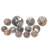 A collection of polished hardstone jasper and agate spheres, largest diameter 12cm