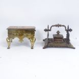 A Victorian brass ink stand, and a Georgian brass miniature footman, footman length 16cm (2)