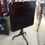 A George III mahogany tilt-top table, on turned column and tripod base, W68cm, H73cm