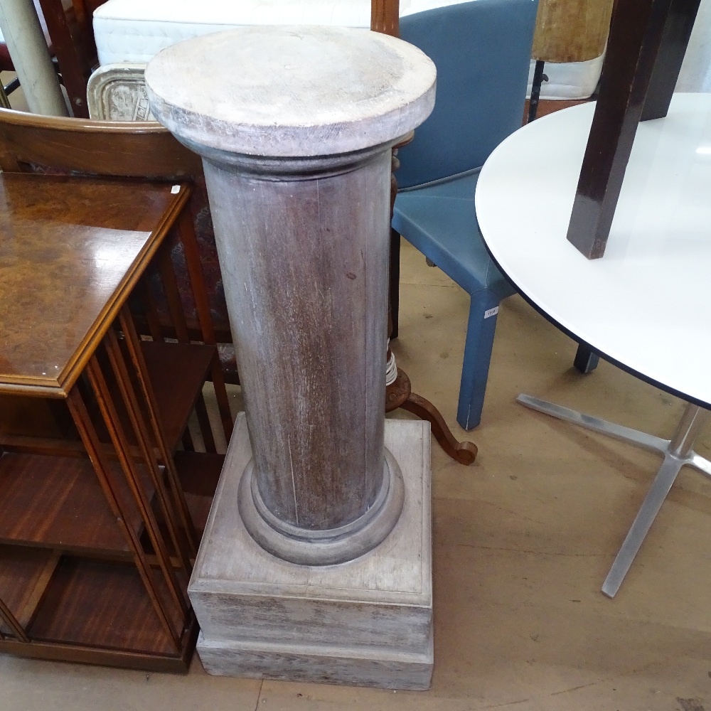 A painted pine column on stepped plinth base, W32cm, H109cm