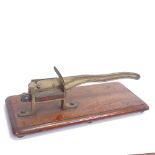 A Victorian table-top brass paper guillotine, on rectangular mahogany base, base length 46cm