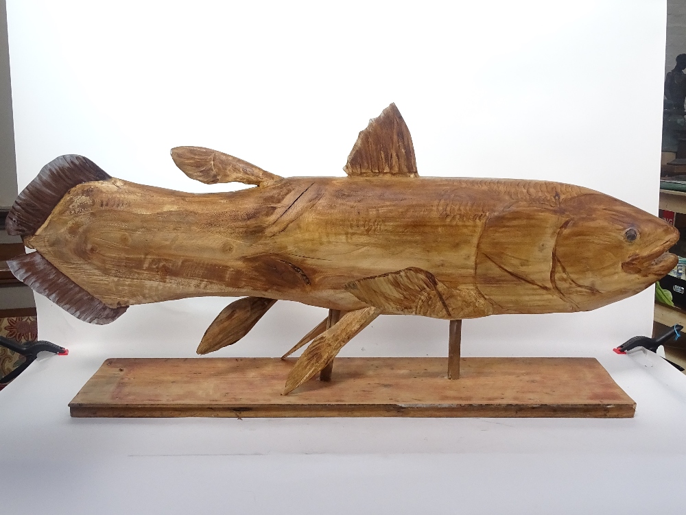 Clive Fredriksson, large carved wood sculpture, Coelacanth on plinth, length 120cm