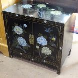 A Chinese low black lacquered cabinet, 2 panelled doors and painted decoration, W66cm, D40cm, H61cm