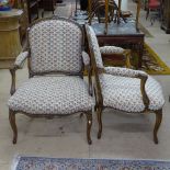A pair of French beech and upholstered open arm bedroom chairs with cabriole legs
