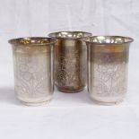 A set of 3 Indian silver beakers, stamped T100 to the underside, height 8cm, 4.8ozs