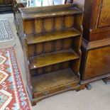 A Titchmarsh & Goodwin reproduction oak graduated open bookcase, with drawer to the base on