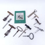 A collection of Vintage and novelty corkscrews, including turned wood handle examples, bullet-end