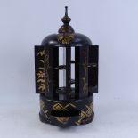 An Oriental ebonised and gilded wood mechanical cigar stand/dispenser, with twisting knop,