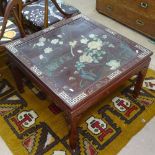 A Chinese red lacquered design glass-top coffee table of square form, with mother-of-pearl and