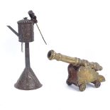 A bronze and brass-mounted table cannon, and a brass oil burner (2)