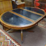 A reproduction mahogany bow-end pull-out dining/boardroom table, having tooled black leather