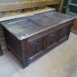 An 18th century oak coffer, with chip carved panelled front, on stile legs, W130cm, D57cm, H54cm