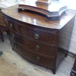A Georgian mahogany bow-front chest, with brushing slide and 3 long drawers under, bracket feet,