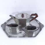 An Arts and Crafts 4-piece Sheffield pewter tea set, comprising teapot, 2-handled sugar bowl,