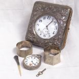 A large silver plated Goliath 8-day pocket watch, in an Art Nouveau sterling silver-fronted travel