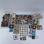A large collection of world coins and banknotes