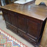 A George III panelled oak mule chest with drawers under, width 4'3", height 33"