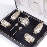 A 5-piece silver cruet set with Bristol blue liners, in original fitted case, by Z Barraclough &