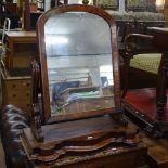 A 19th century mahogany arch-top swing toilet mirror